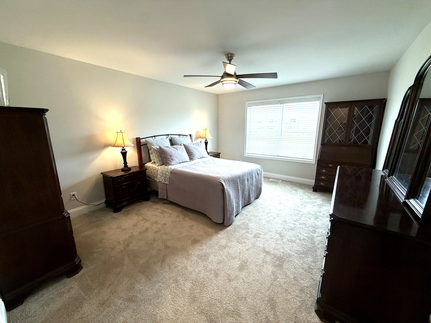 2222 Maggie Lane Sycamore, IL 60178 - Photo 12 of 24 a spacious bedroom with a bed furniture and a flat tv screen