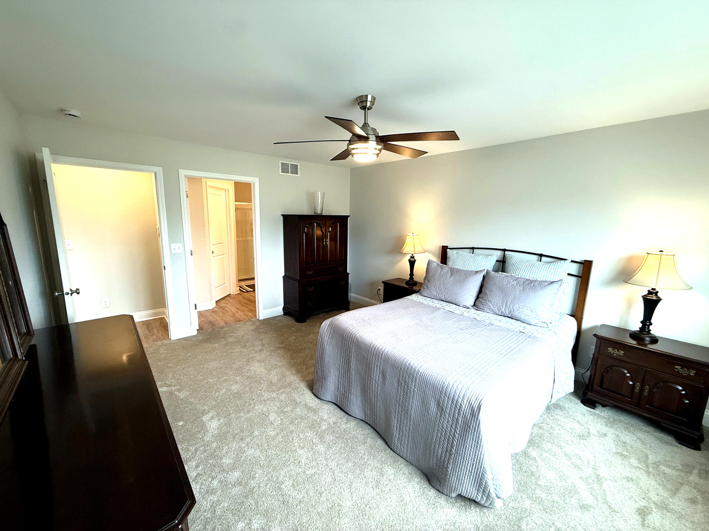 2222 Maggie Lane Sycamore, IL 60178 - Photo 13 of 24 a bedroom with a bed and a chandelier