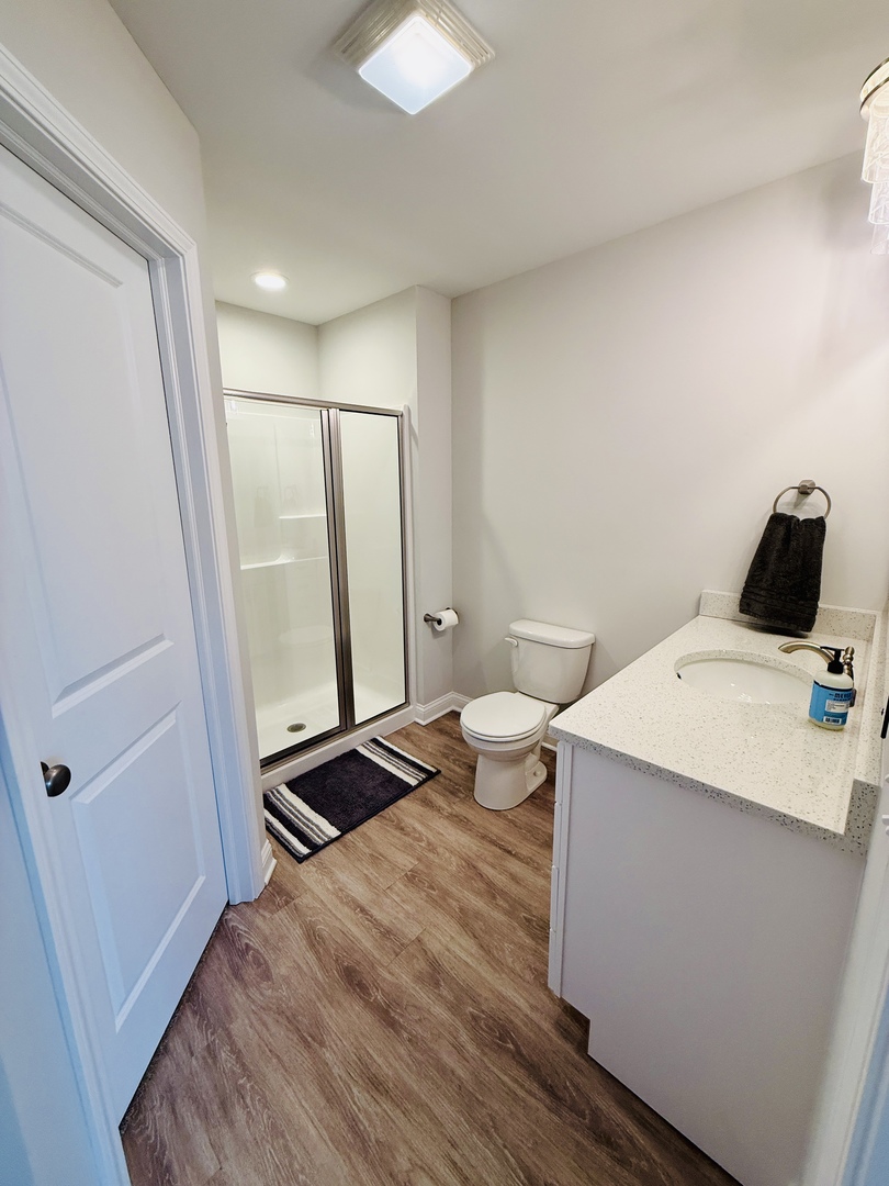 2222 Maggie Lane Sycamore, IL 60178 - Photo 14 of 24 a bathroom with a sink a toilet and shower