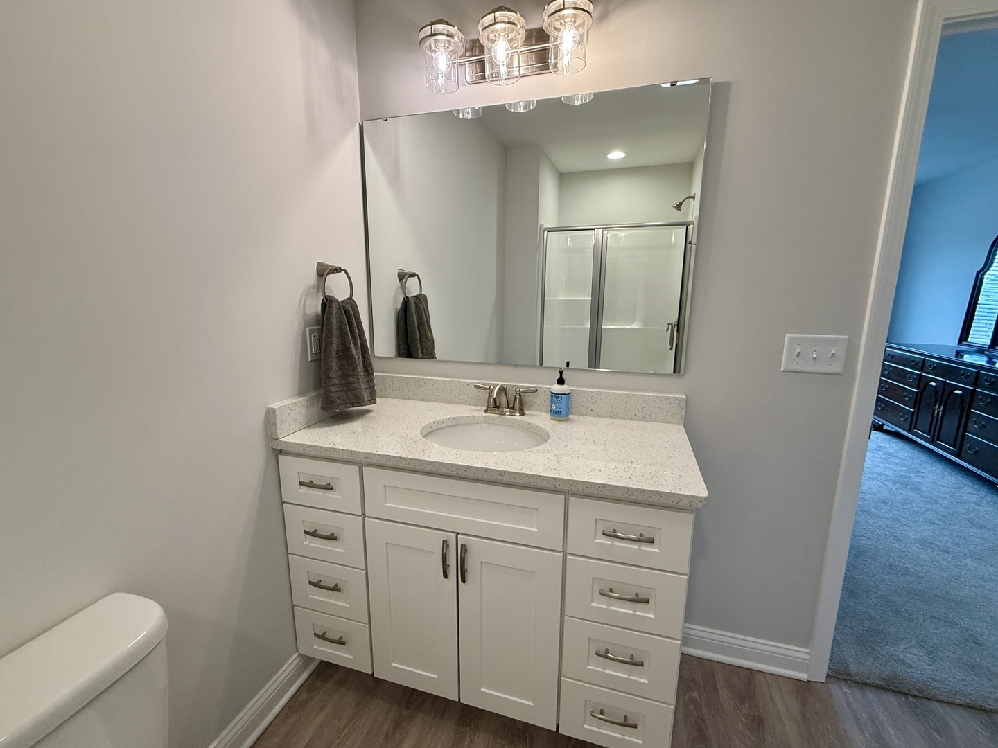 2222 Maggie Lane Sycamore, IL 60178 - Photo 16 of 24 a bathroom with a sink a vanity and a mirror