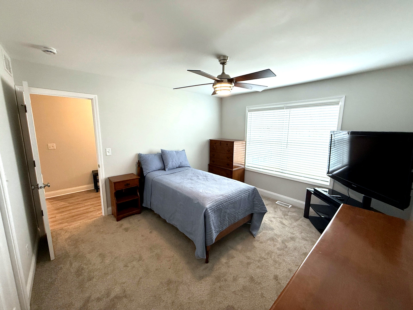 2222 Maggie Lane Sycamore, IL 60178 - Photo 18 of 24 a bedroom with a bed and a flat screen tv