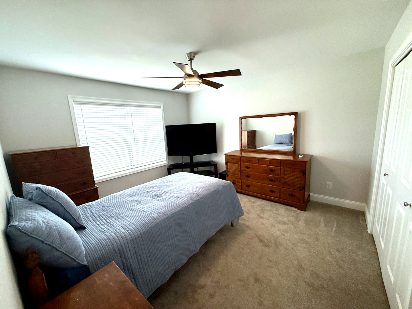 2222 Maggie Lane Sycamore, IL 60178 - Photo 19 of 24 a bedroom with a bed window and a flat screen tv