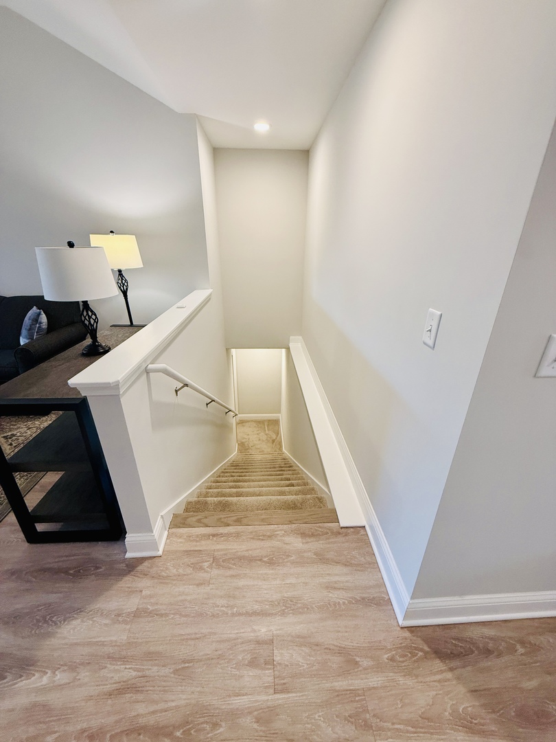 2222 Maggie Lane Sycamore, IL 60178 - Photo 21 of 24 a view of a livingroom with wooden floor and staircase