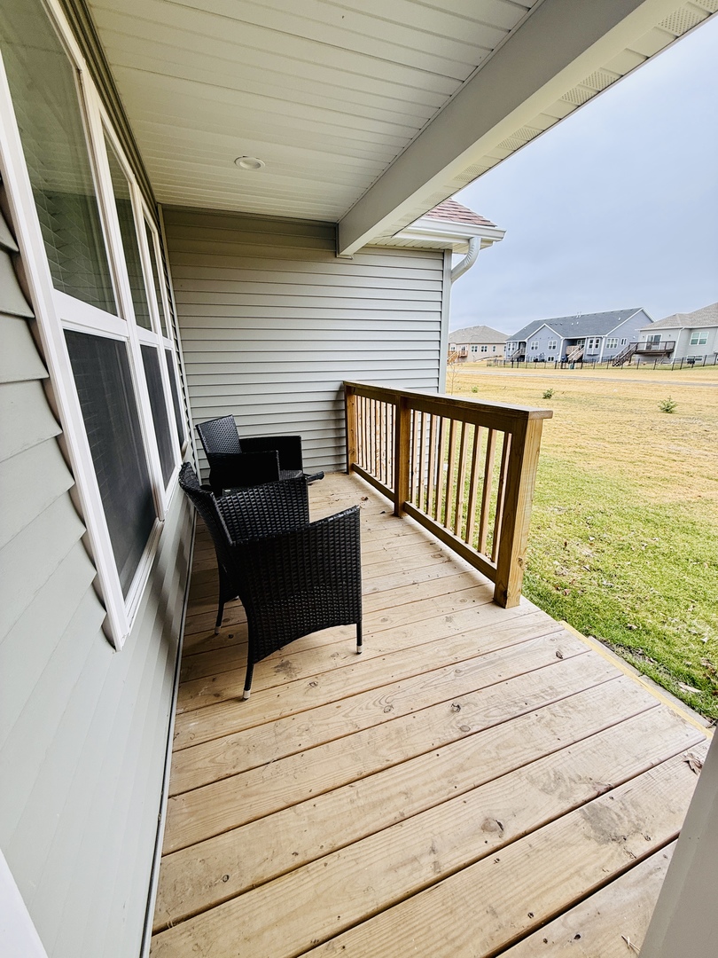 2222 Maggie Lane Sycamore, IL 60178 - Photo 23 of 24 a view of balcony with wooden floor and outdoor seating