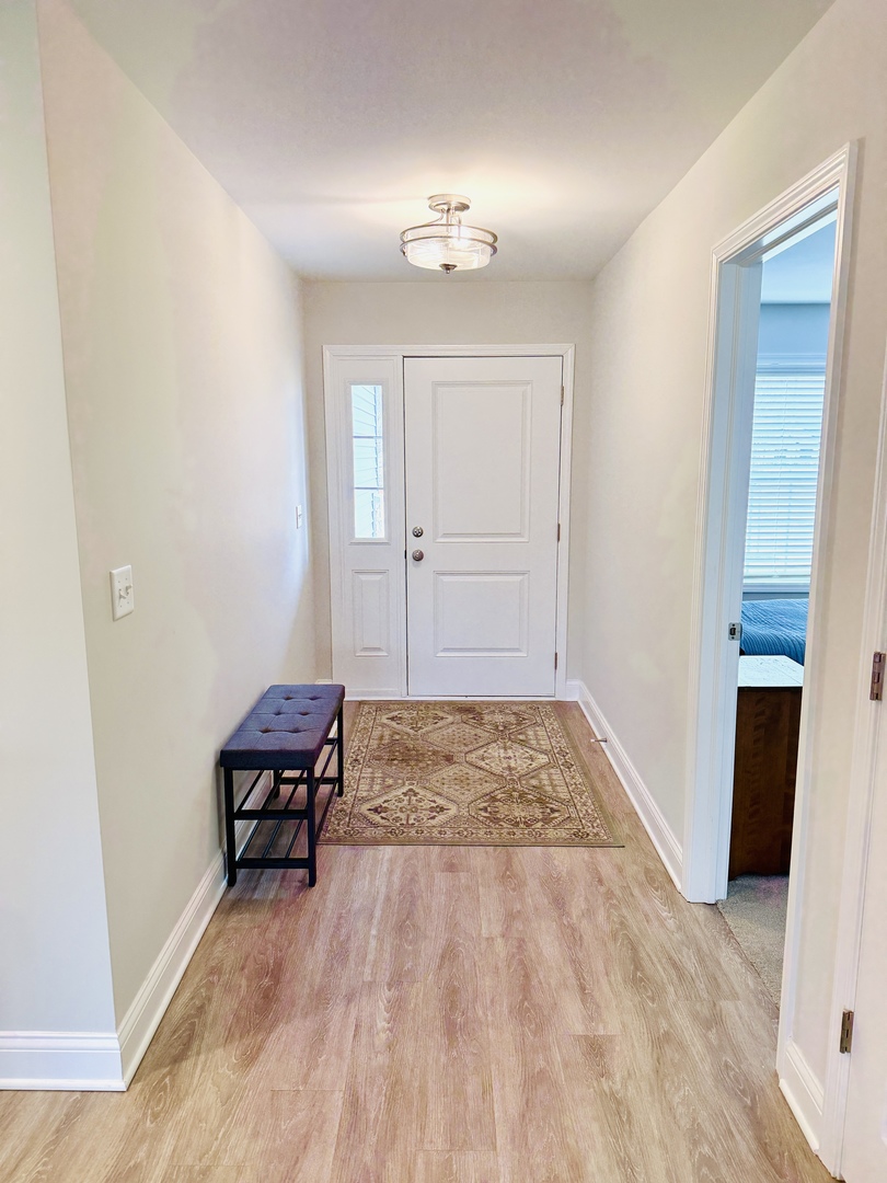 2222 Maggie Lane Sycamore, IL 60178 - Photo 3 of 24 a view of livingroom with hardwood floor and ceiling fan