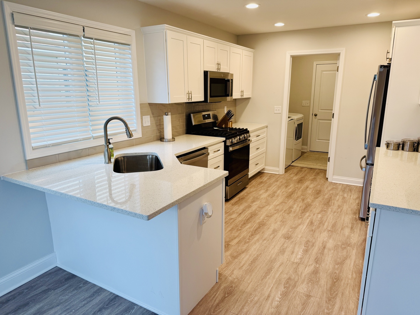 2222 Maggie Lane Sycamore, IL 60178 - Photo 10 of 24 a kitchen with a stove a sink and a refrigerator