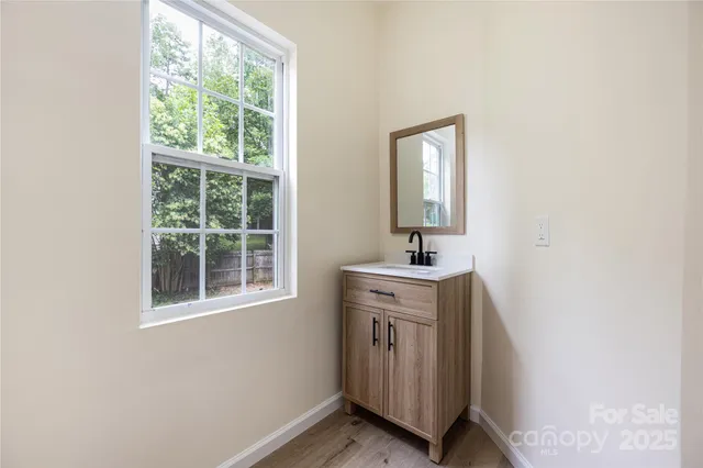 a room with a window and a sink