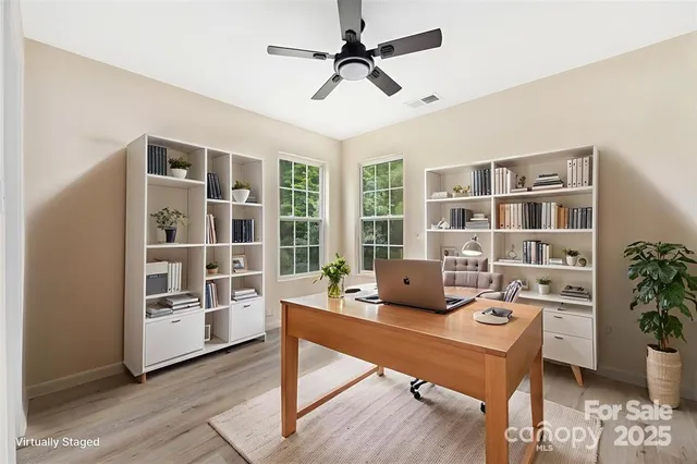 a work room with furniture and book shelf