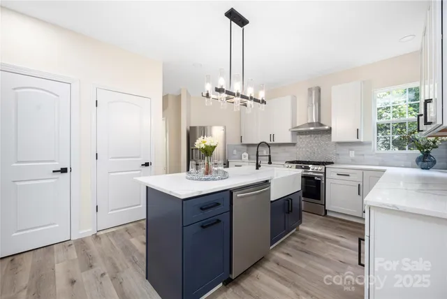 a kitchen with a sink stove and cabinets