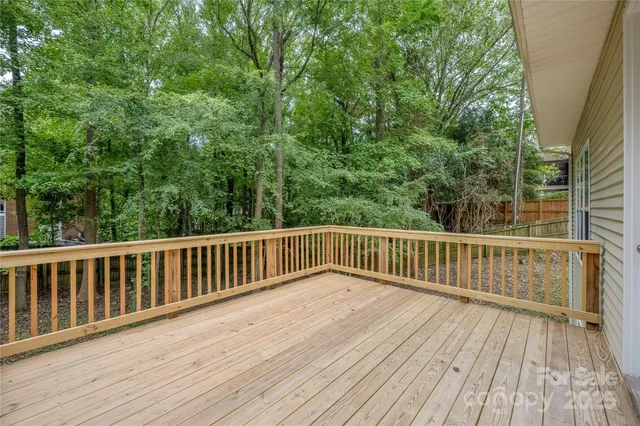 a view of balcony with wooden floor