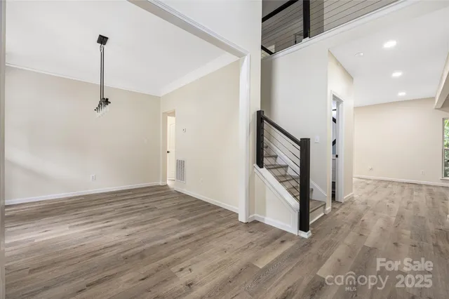a view of an entryway with wooden floor