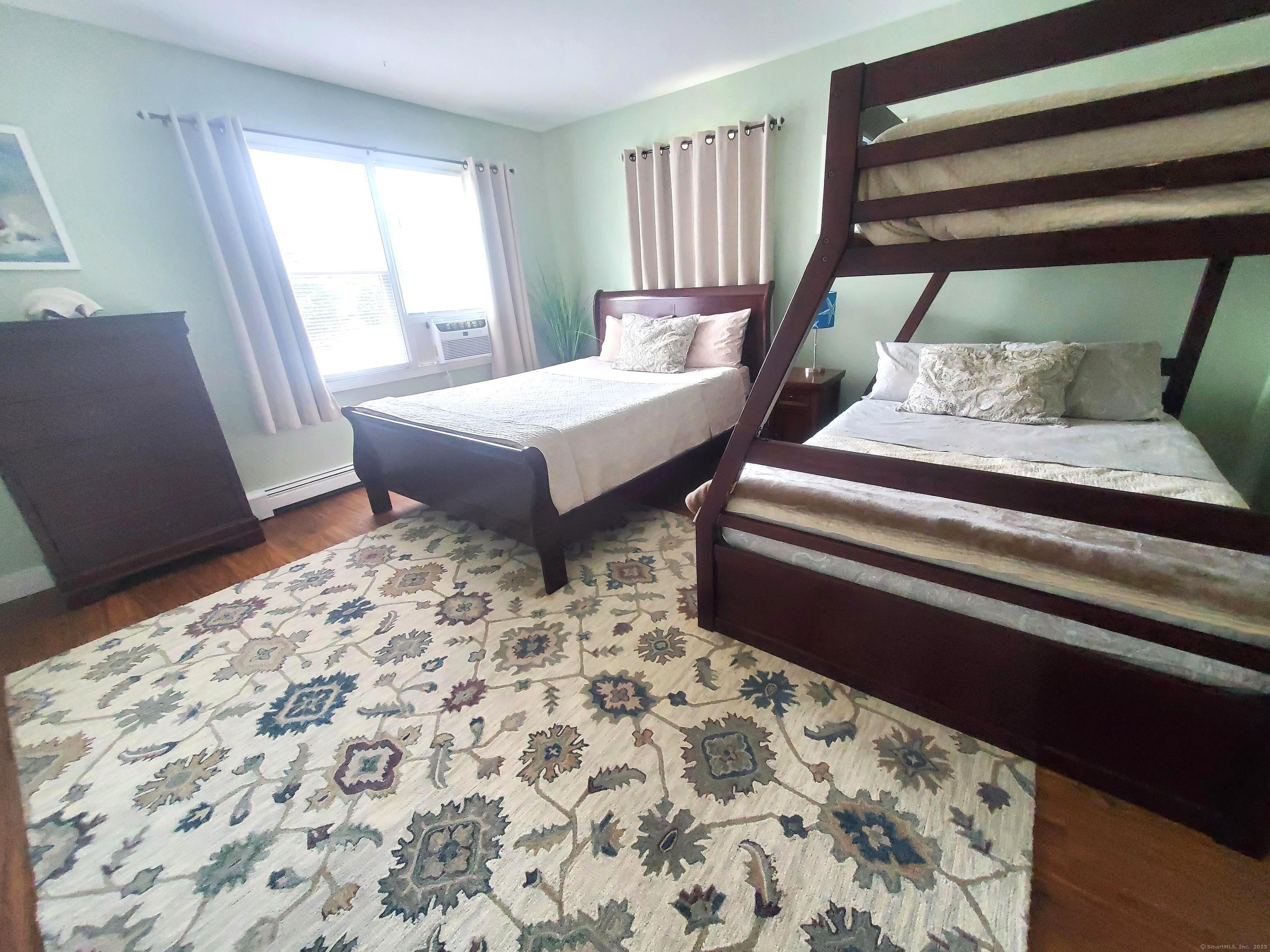 39 Nash Place, Unit A Norwalk, CT 06854 - Photo 14 of 29 a bedroom with furniture and a window