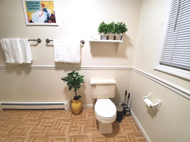a bathroom with a toilet and a sink