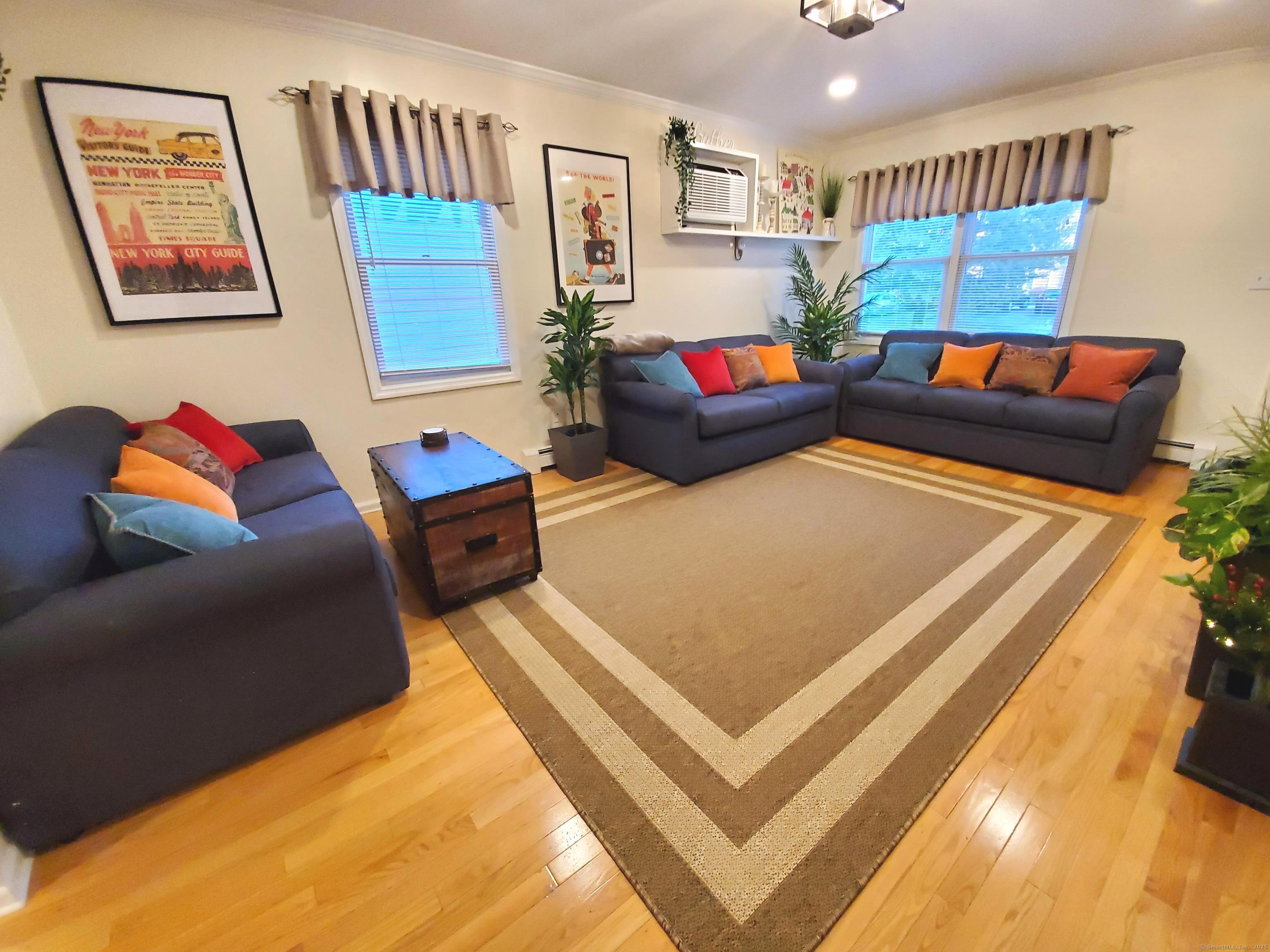 39 Nash Place, Unit A Norwalk, CT 06854 - Photo 2 of 29 a living room with furniture and a couch