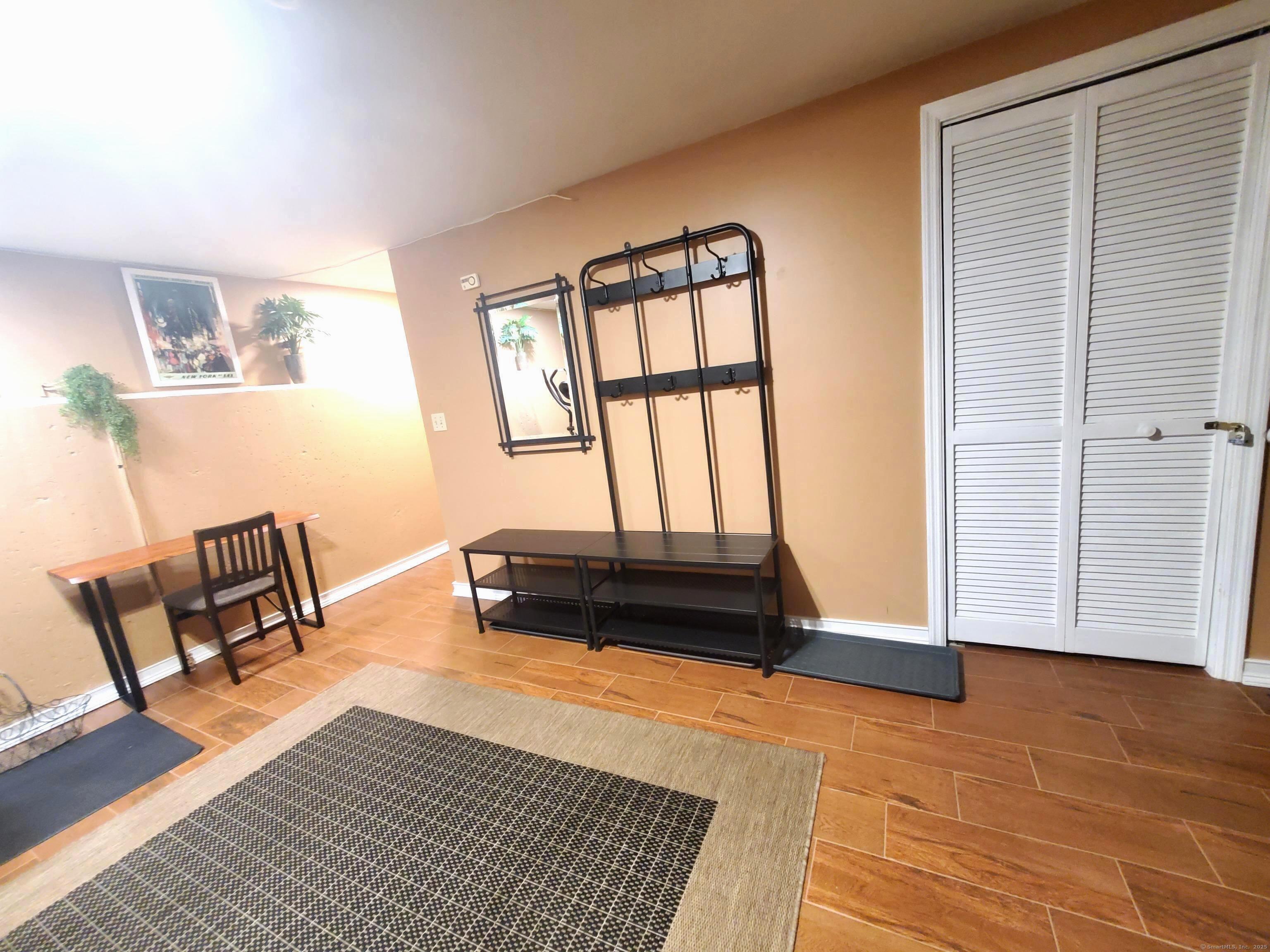 39 Nash Place, Unit A Norwalk, CT 06854 - Photo 22 of 29 a living room with furniture and a window