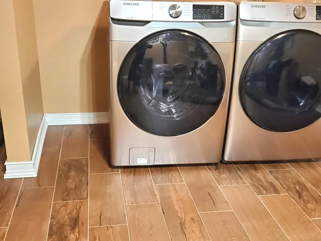 a view of a hallway with washer and dryer