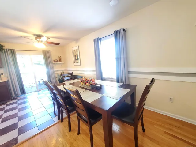 a view of a dining room with furniture and window