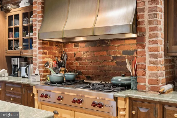a kitchen with a stove and a sink