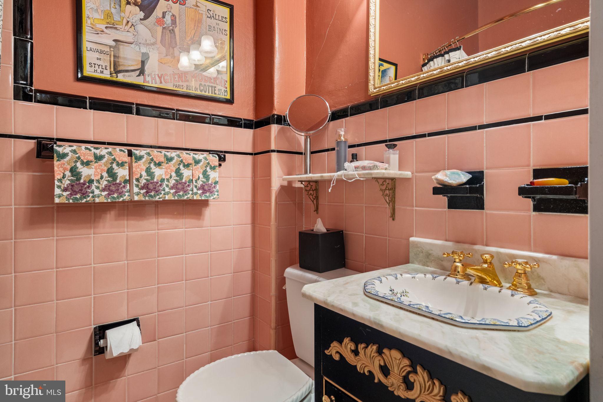 1017 Clinton Street Philadelphia, PA 19107 - Photo 25 of 38 a bathroom with a sink and a mirror