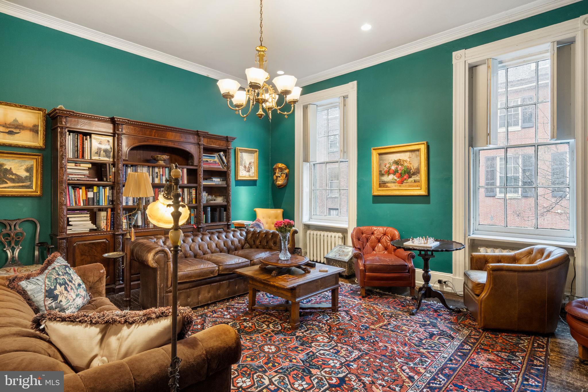 1017 Clinton Street Philadelphia, PA 19107 - Photo 29 of 38 a living room with furniture chandelier and a window
