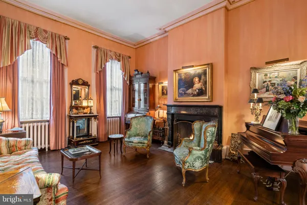 a living room with furniture fireplace and flat screen tv