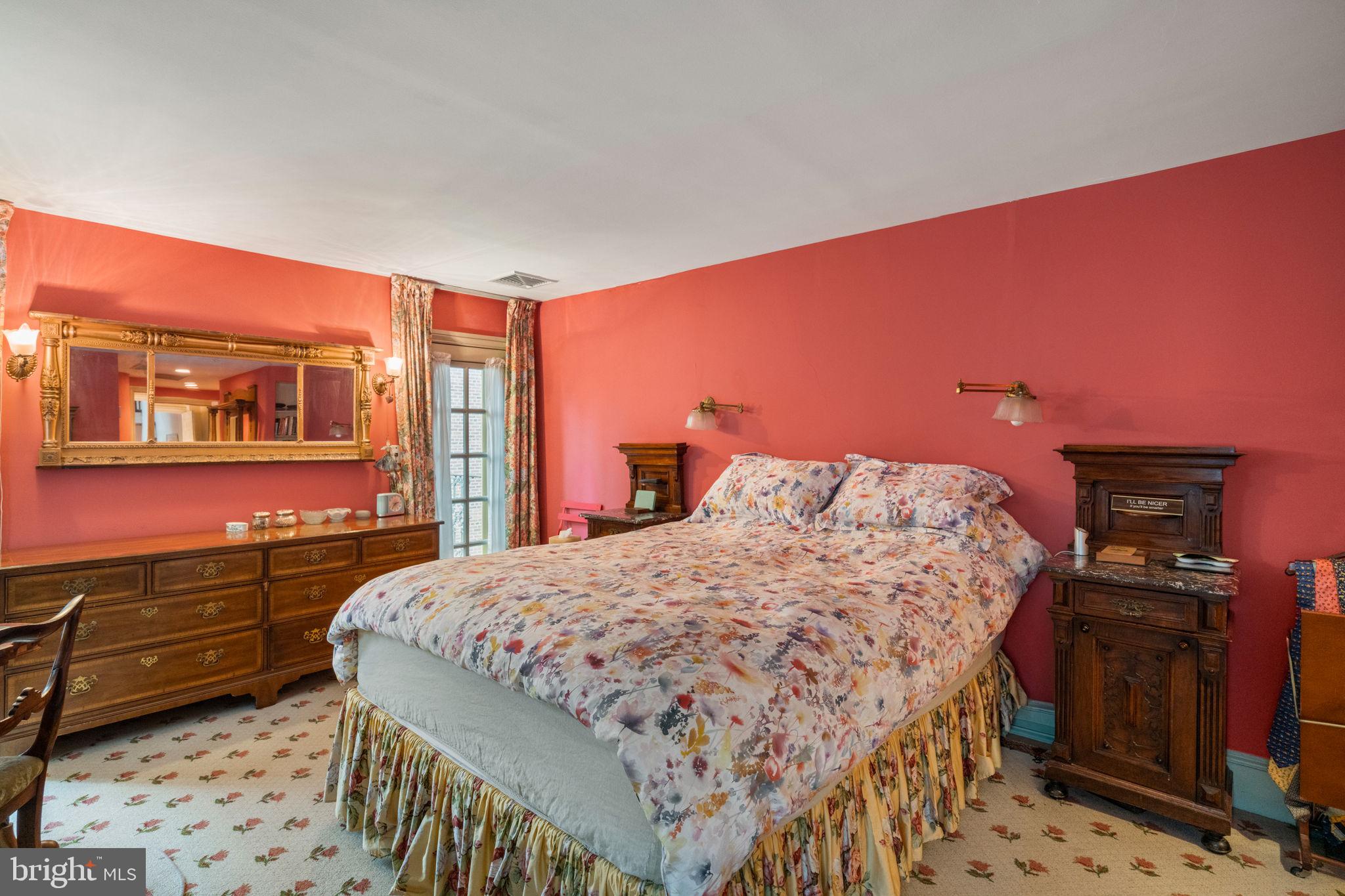 1017 Clinton Street Philadelphia, PA 19107 - Photo 32 of 38 a bedroom with a bed and wooden floor