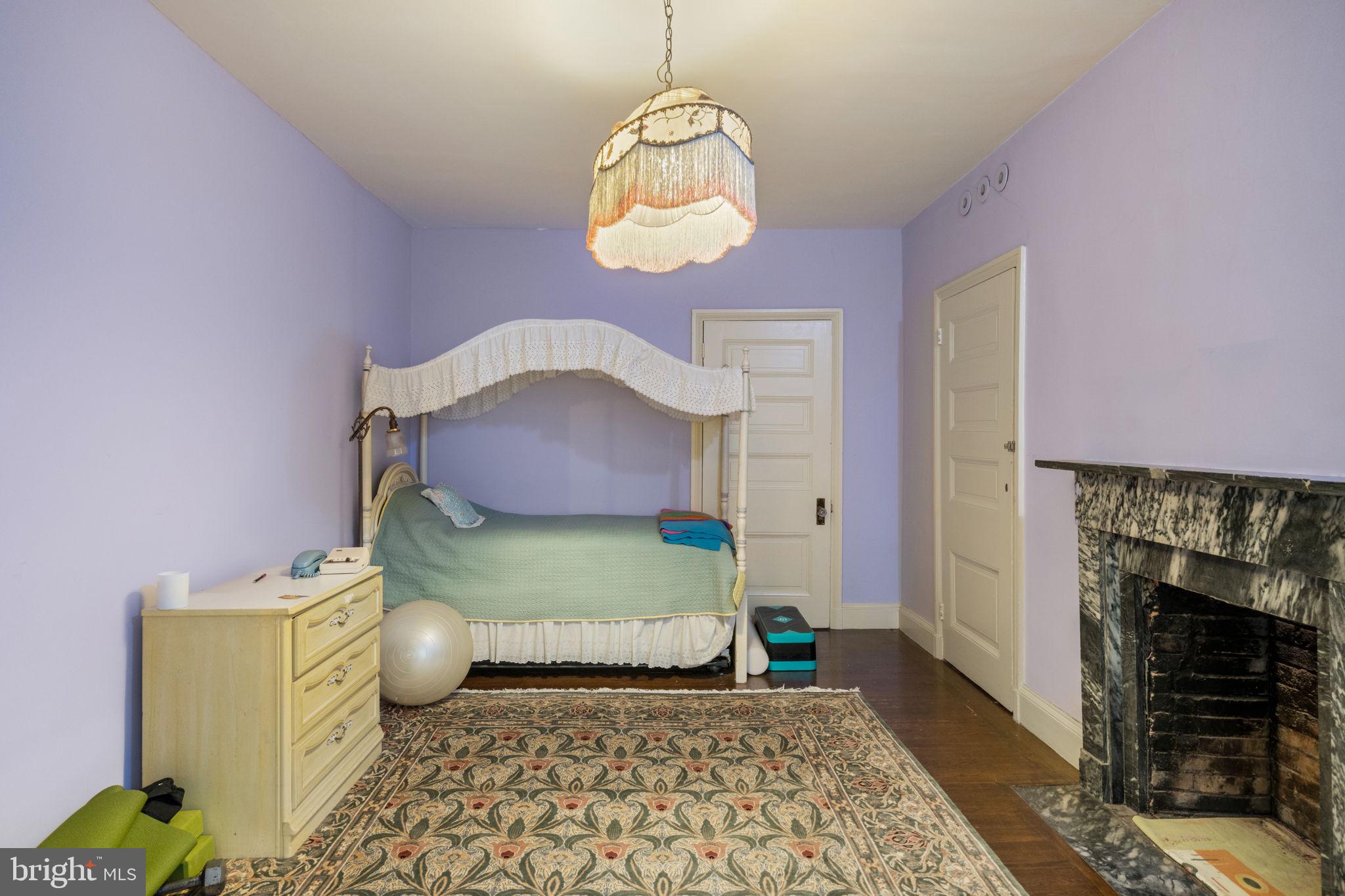 1017 Clinton Street Philadelphia, PA 19107 - Photo 35 of 38 a bedroom with a bed and a window
