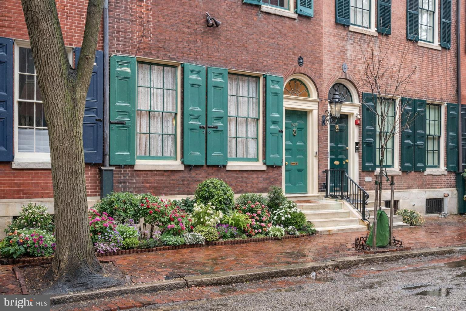1017 Clinton Street Philadelphia, PA 19107 - Photo 37 of 38 a front view of a house with a garden