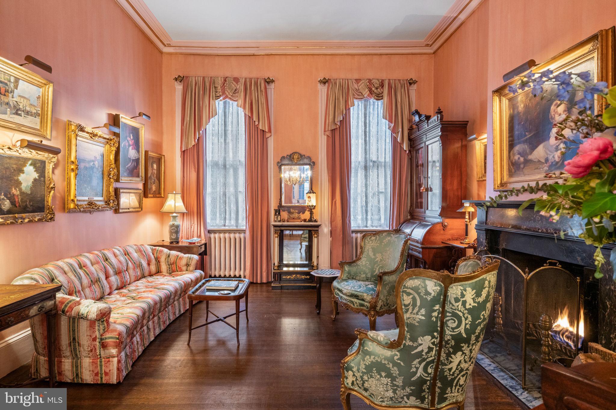 1017 Clinton Street Philadelphia, PA 19107 - Photo 4 of 38 a living room with furniture a fireplace and decor