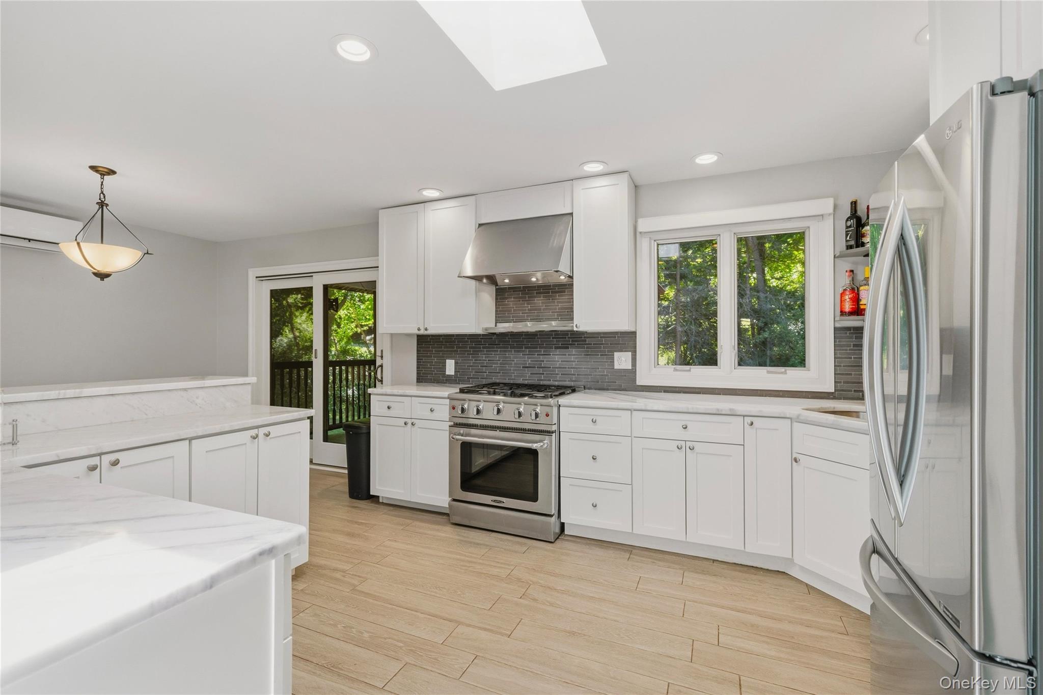 44 Sayer Road Blooming Grove, NY 10914 - Photo 12 of 39 a kitchen with stainless steel appliances granite countertop a stove a sink and a refrigerator