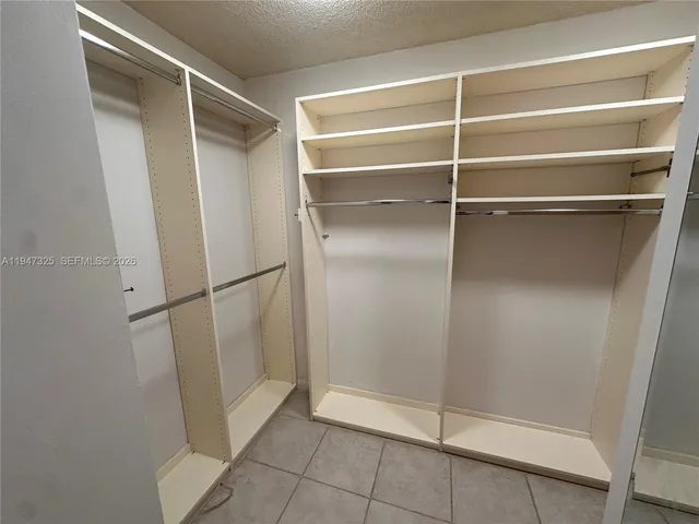 a view of an empty walk in closet