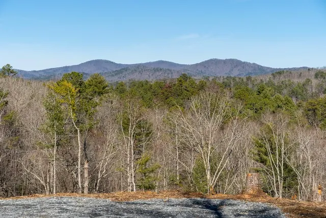 a view of a mountain with a mountain in the background