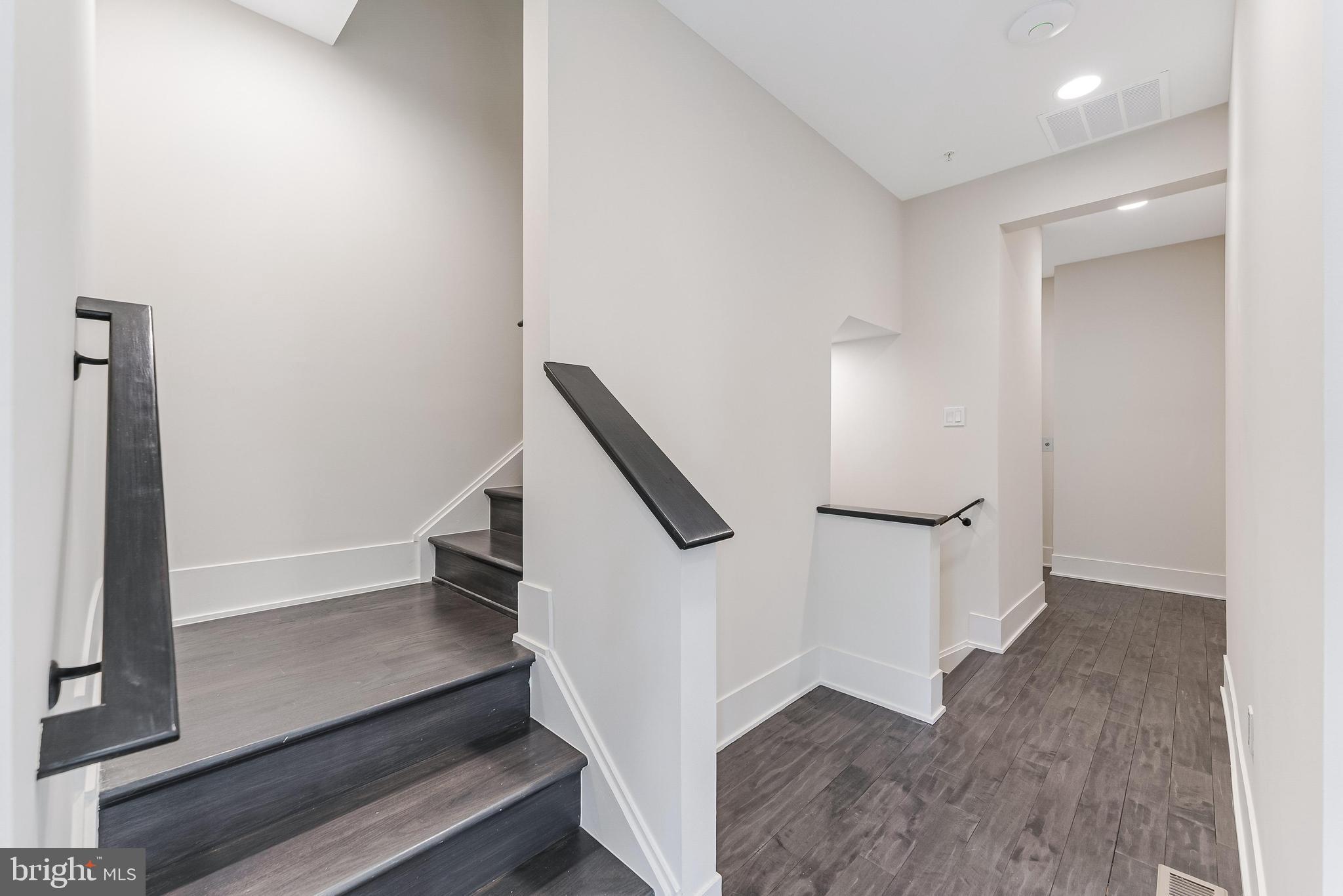 5125 Willet Bridge Road Bethesda, MD 20816 - Photo 19 of 47 a view of entryway with stairs and wooden floor
