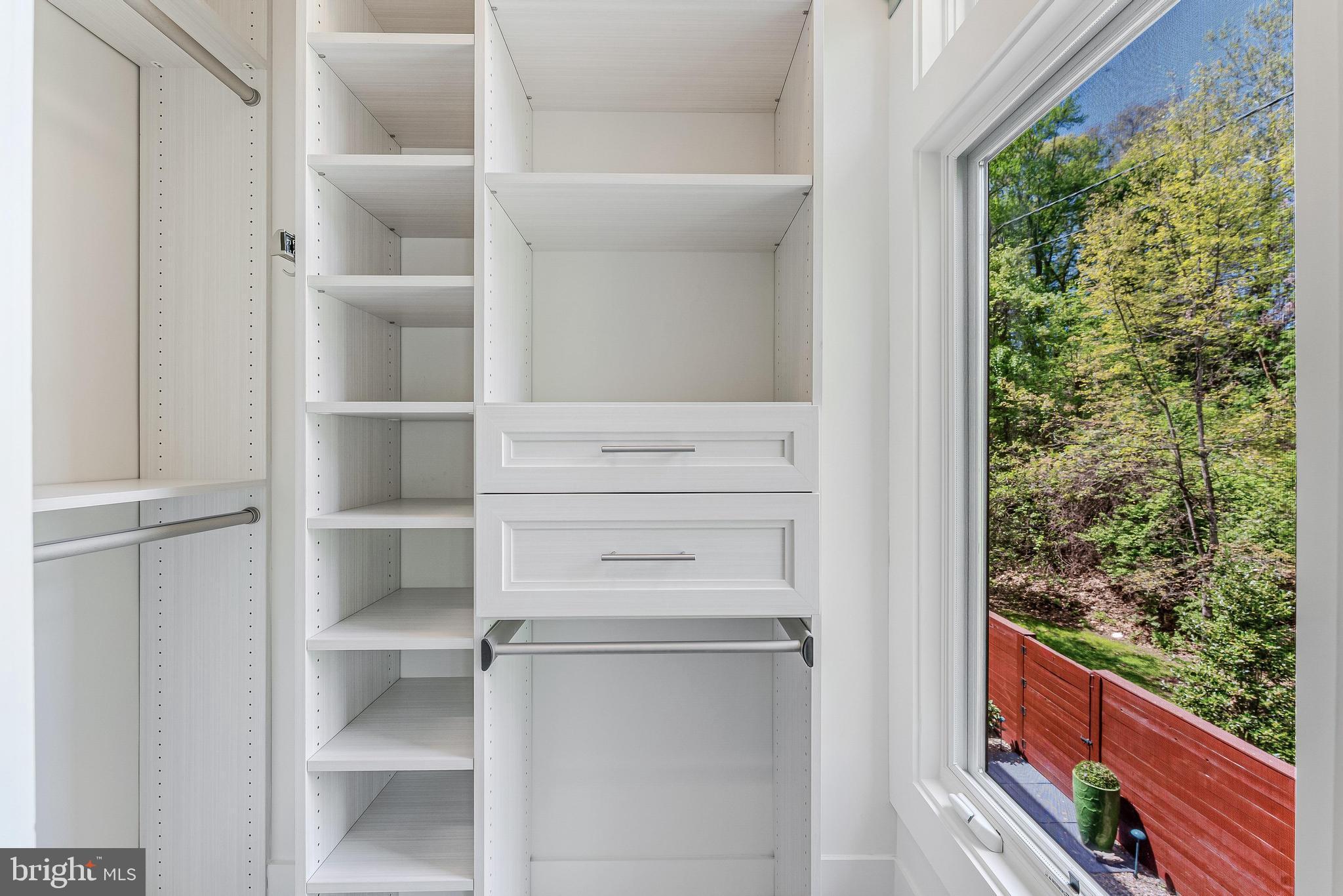 5125 Willet Bridge Road Bethesda, MD 20816 - Photo 25 of 47 a view of walk in closet with clothes