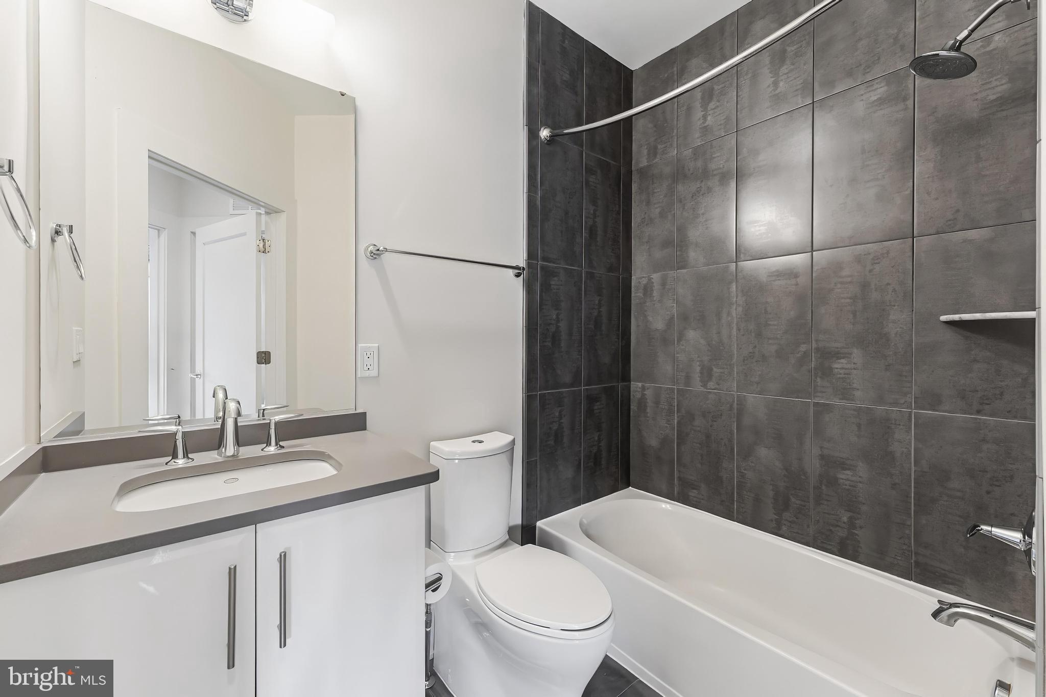 5125 Willet Bridge Road Bethesda, MD 20816 - Photo 28 of 47 a bathroom with a sink a toilet and shower
