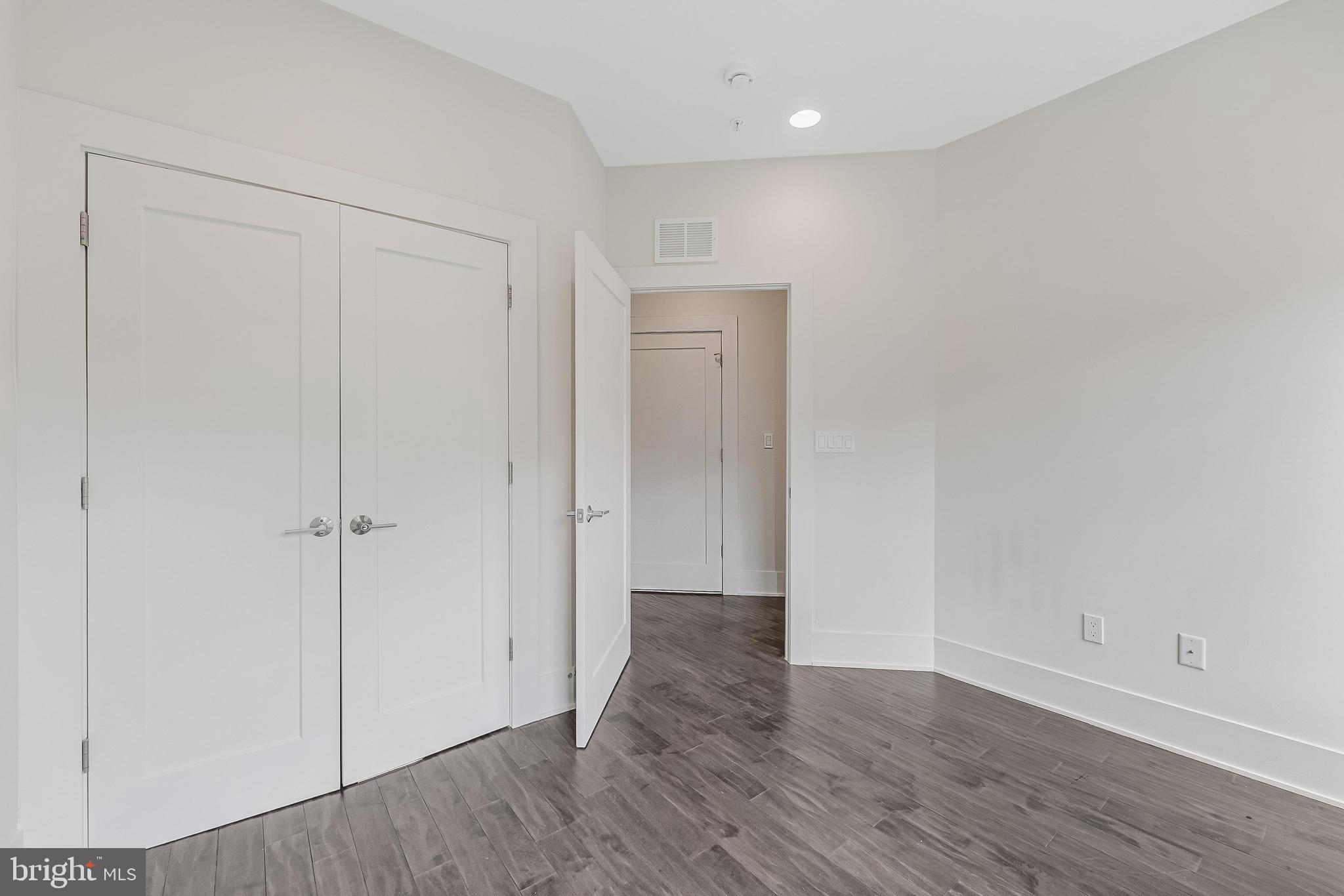 5125 Willet Bridge Road Bethesda, MD 20816 - Photo 30 of 47 a view of an empty room with wooden floor