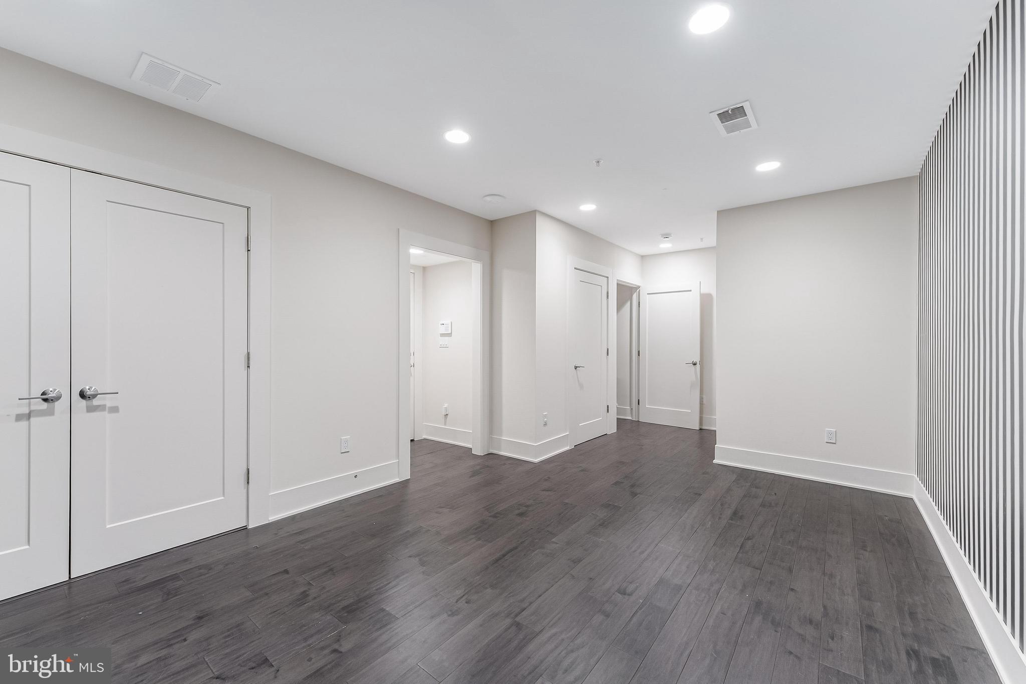 5125 Willet Bridge Road Bethesda, MD 20816 - Photo 41 of 47 a view of an empty room with wooden floor