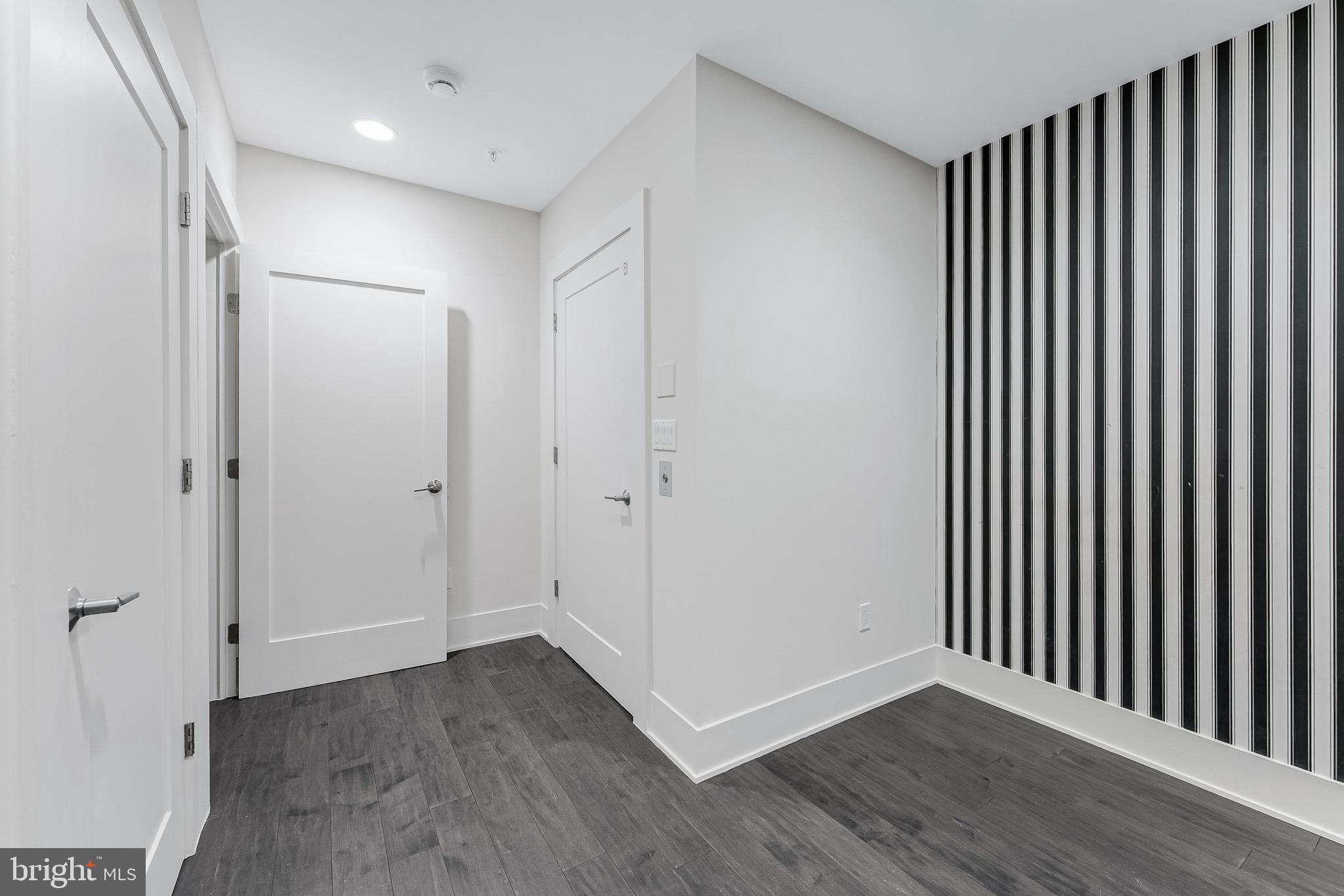5125 Willet Bridge Road Bethesda, MD 20816 - Photo 42 of 47 a view of a hallway with wooden floor