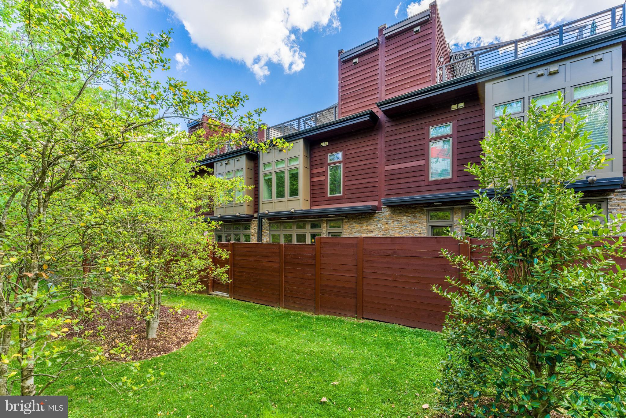 5125 Willet Bridge Road Bethesda, MD 20816 - Photo 46 of 47 a view of a backyard with plants and large tree