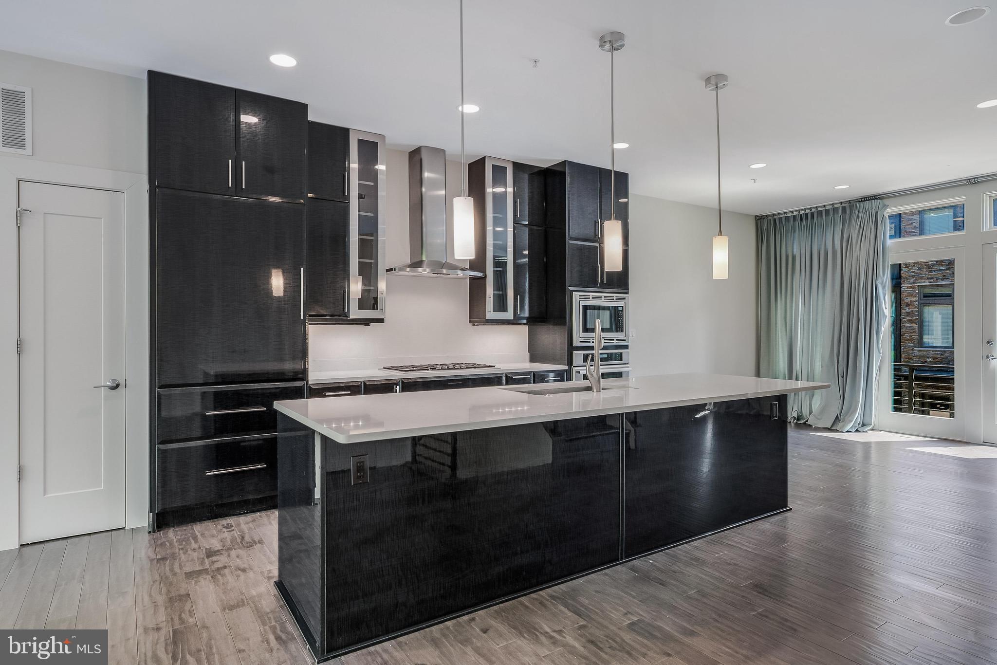 5125 Willet Bridge Road Bethesda, MD 20816 - Photo 6 of 47 a kitchen with stainless steel appliances granite countertop a refrigerator a sink and a stove