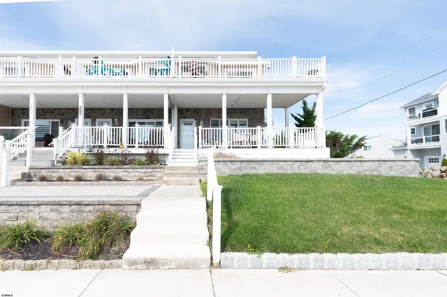a view of a building with a yard