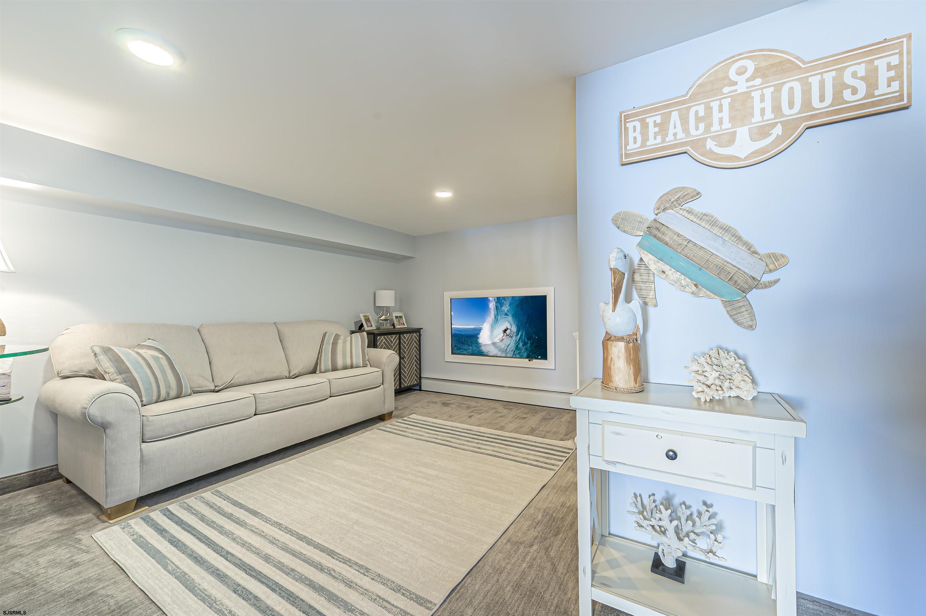 815 East Brigantine Avenue, Unit 7 Brigantine, NJ 08203 - Photo 25 of 31 a living room with furniture a rug and a window
