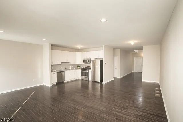 a view of a kitchen with a sink and cabinets