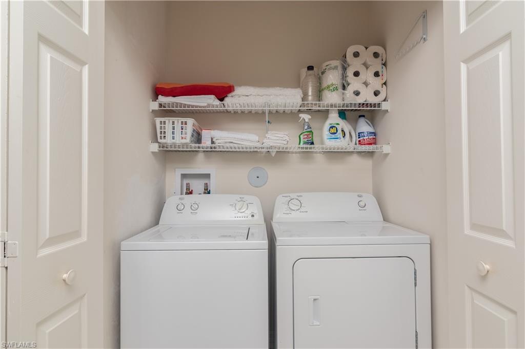2585 Old Groves Road, Unit L102 Naples, FL 34109 - Photo 13 of 29 a utility room with dryer and washer