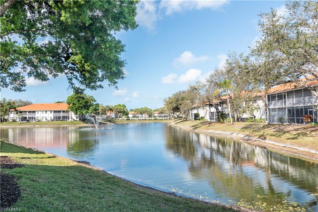 2585 Old Groves Road, Unit L102 Naples, FL 34109 - Photo 15 of 29 a view of a lake with houses