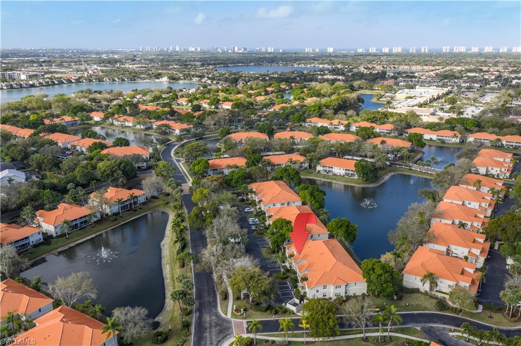 2585 Old Groves Road, Unit L102 Naples, FL 34109 - Photo 21 of 29 an aerial view of residential houses with outdoor space