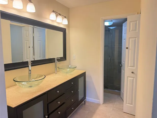 a white toilet sitting next to a bathroom shower