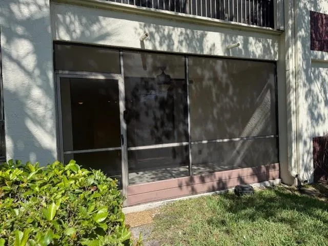 a view of a street with a house in the background