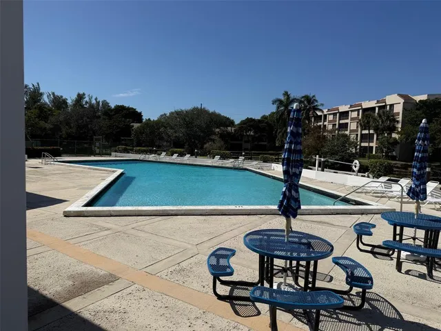 a view of a house with swimming pool