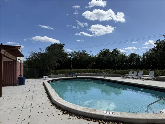 a view of a backyard with plants and a garden